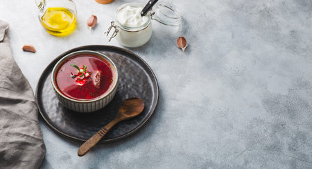 Traditional Ukrainian beet soup - borscht on the gray background, copy space for text. High quality...