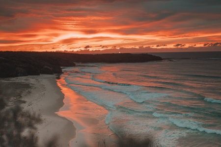 A sunrise over a beach.の写真素材