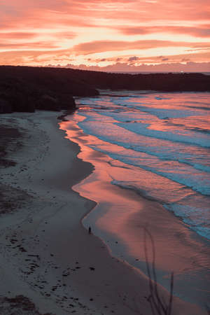 A sunrise over a beach.の写真素材