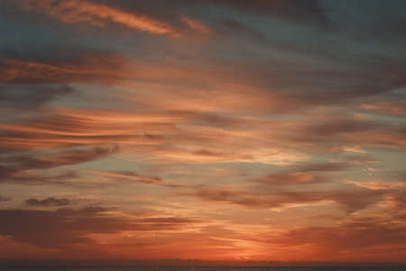A sunrise over a beach.の写真素材