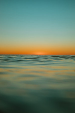Sun rising over the water at Mollymook Beach.