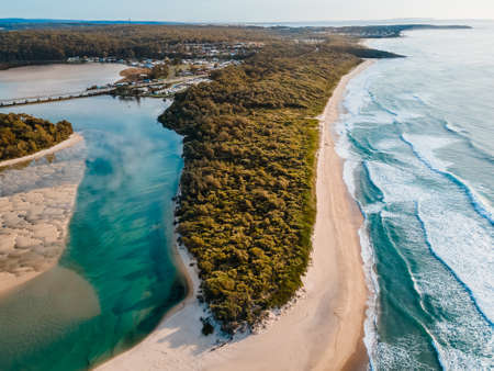 Aerial photo of a beach and trees in Ulladulla, NSW, Australiaの写真素材
