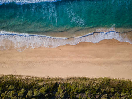 Aerial photo of a beach and trees in Ulladulla, NSW, Australiaの写真素材