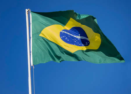 Brazilian Flag on a blue sky   Ordem E Progresso の写真素材