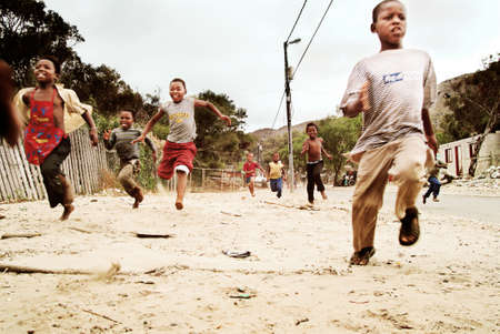 Children running. Township in South Africa.のeditorial素材