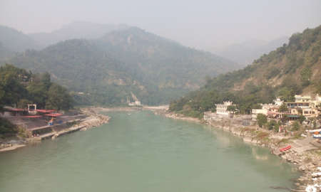 Ganges River besides in the himalayan foothills at Rishikesh Uttara Khand India.のeditorial素材