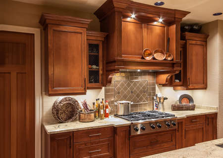 Home Stove Top Range and Cabinets in New Luxury Homeの写真素材