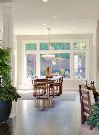 newly constructed home with beautiful furnished living room and dining room, complete with hardwood floorsの写真素材