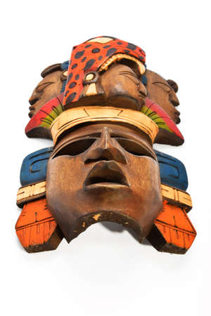 Indian Mayan Aztec wooden painted mask with roaring jaguar and human profiles isolated on white backgroundの写真素材