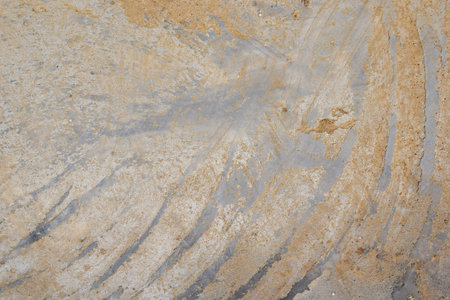 Concrete wall or floor with dirty diagonal stripes strokes pattern on cement