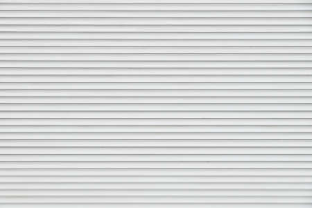 White and gray horizontal metal window roller blinds backgroundの写真素材