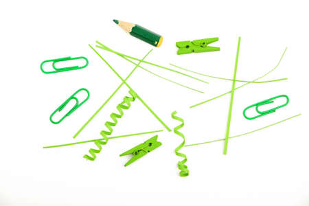 Small things matter, mixed colorful green paper pieces and wooden painted clothespins isolated on white backgroundの写真素材