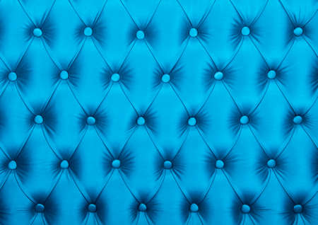 Blue capitone textile background, retro Chesterfield style checkered soft tufted fabric furniture diamond pattern decoration with buttons, close upの写真素材
