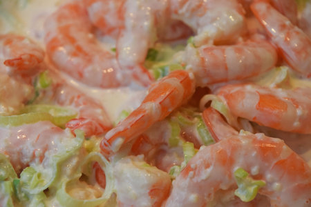 Fresh shrimp cocktail salad with vegetables and white sauce, close up, high angle view, personal perspectiveの写真素材