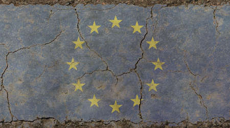 Old grunge vintage dirty faded shabby distressed European Union EU national flag background on broken concrete wall with cracksの写真素材