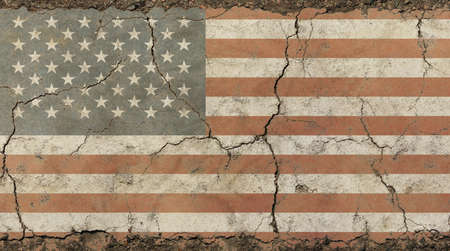 Old grunge vintage dirty faded shabby distressed American US national flag background on broken concrete wall with cracksの写真素材