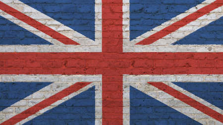 Old grunge vintage UK Great Britain national flag graffiti over background of white brick wallの写真素材