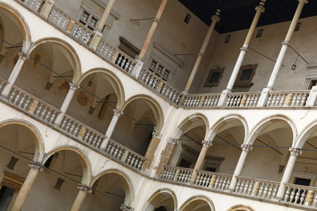 Inner gallery arches of medieval Wawel Royal Castle, one of most popular tourist attractions and landmarks in Krakow, Polandのeditorial素材