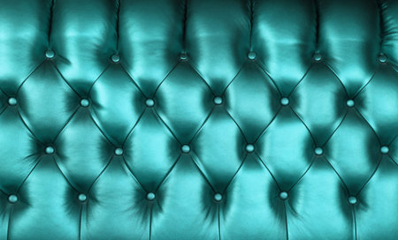 Background texture of teal blue capitone genuine leather, retro Chesterfield style soft tufted...