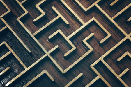 Close up of dark brown wooden labyrinth maze, toy puzzle game, elevated high angle view