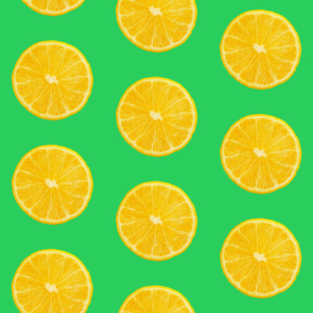 Seamless pattern of fresh ripe orange round cut wedges on vivid green background