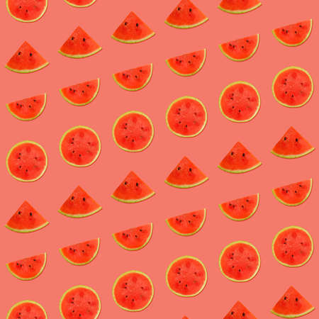 Seamless pattern of fresh red ripe juicy watermelon round cut wedges on vivid coral pink backgroundの写真素材