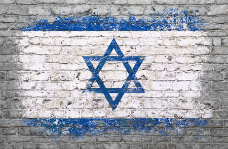 Grunge distressed flag of Israel painted on old weathered grey brick wallの写真素材