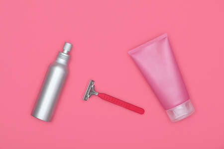 Feminine beauty care flat lay of shaving set on pink background, elevated top view, directly aboveの写真素材
