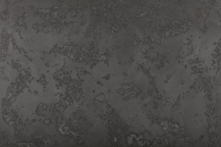 Grunge grey faded uneven old aged daub plaster wall texture background with stains and paint...