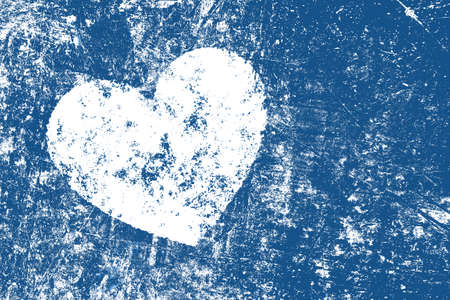 Grunge white heart over dark indigo blue noisy abstract romantic backgroundの写真素材