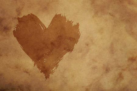 Dark painted heart with brushstroke shape over grunge brown paper backgroundの写真素材