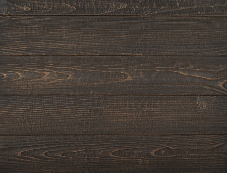 Vintage brown wooden planks background texture with scratches and stains over painted weathered wood...