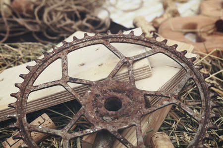 Still life background of old vintage rusty metal cog, wine cork and wood, close up, high angle viewの写真素材