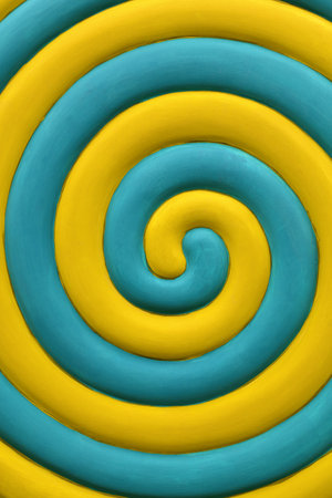 Close up abstract multicolor background of yellow and teal blue spiralの写真素材