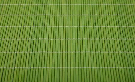 Close up natural green bamboo wood mat background texture, high angle view, personal perspectiveの写真素材