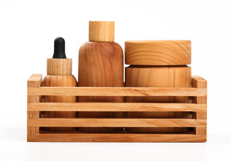 Close up set of beauty care and personal hygiene products in wooden containers, in organizer, isolated on white background, low angle, side view, close upの写真素材