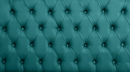 Close up background texture of turquoise teal blue capitone genuine leather, retro Chesterfield style soft tufted furniture upholstery with deep diamond pattern and buttonsの写真素材