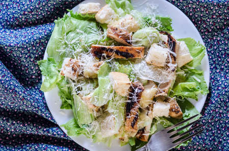 Classic caesar chicken salad on wooden table rustic styleの写真素材