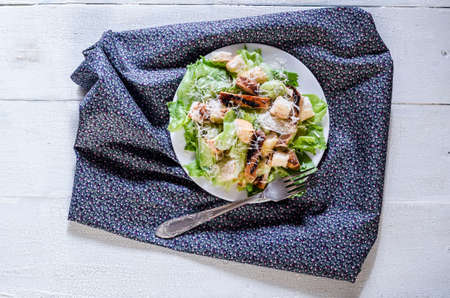 Classic caesar chicken salad on wooden table rustic styleの写真素材