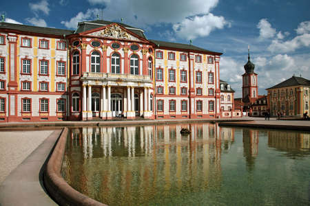 Beautiful baroque castle with water reflectionの写真素材
