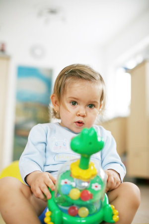 Little girl with toys