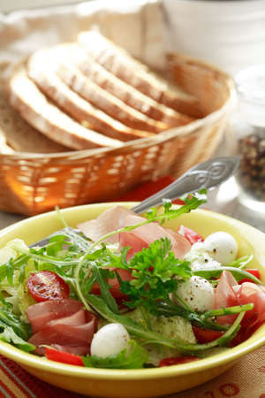 Healthy salad with gammon and cheeseの写真素材