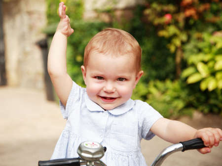 Portrait of cute kid with bikeの写真素材