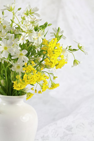 Beautiful forest flowers as table decoration の写真素材