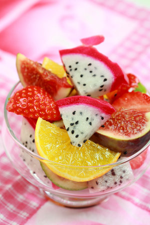 Delicious fresh fruits in bowl as dessert