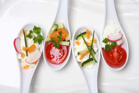 Fingerfood served in small spoonsの写真素材