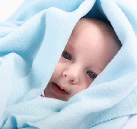 Adorable newborn swathed in cloth 