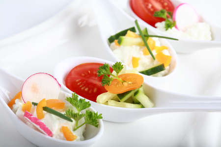Fingerfood served in small spoonsの写真素材