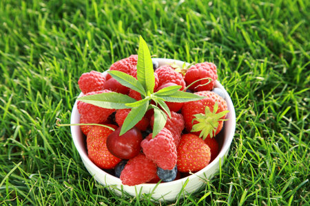 Delicious fresh fruits in bowl as dessertの写真素材