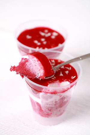 Vanilla ice cream with mixed frozen fruitsの写真素材